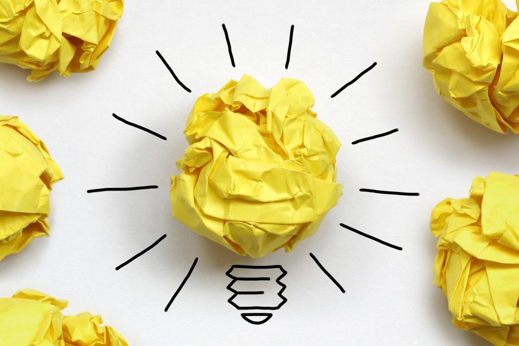 Inspiration concept crumpled paper light bulb metaphor for good idea