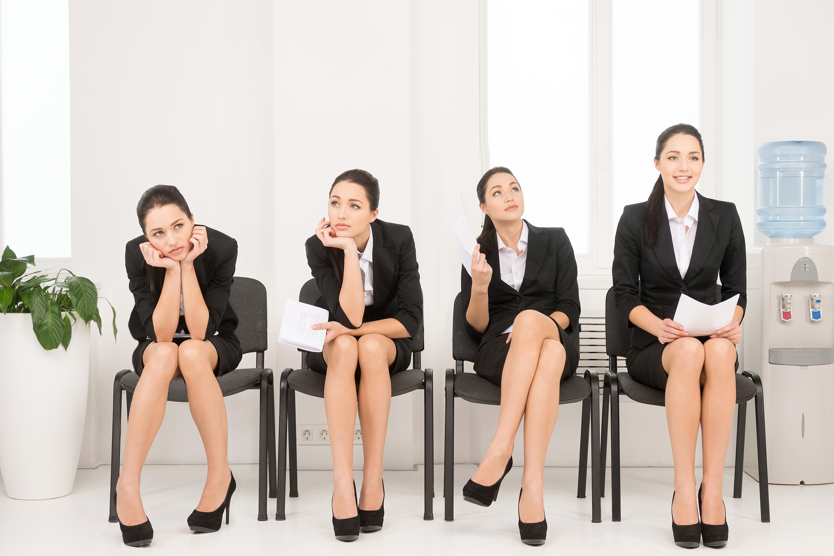 Four different poses of one woman waiting for interview. Sitting in office on chair.